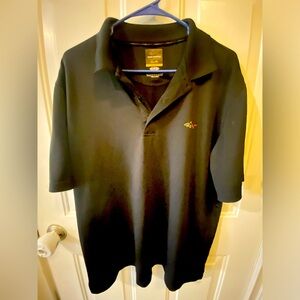 Greg Norman black men's polo with shark logo.
